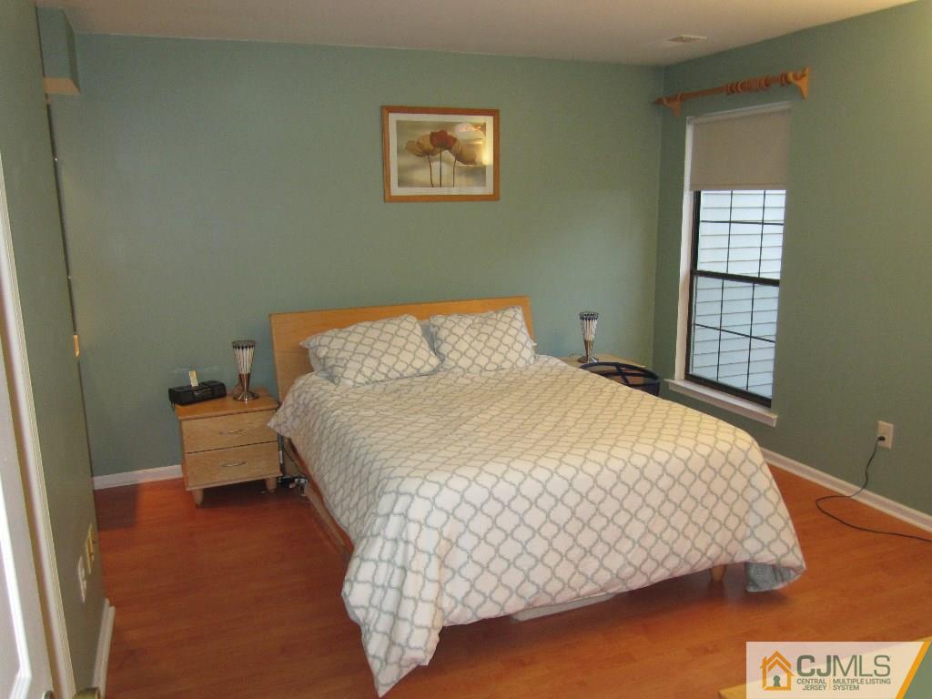 2201 Timber Oaks Road Edison, NJ 08820 - Photo 10 of 12 a bedroom with a bed and window