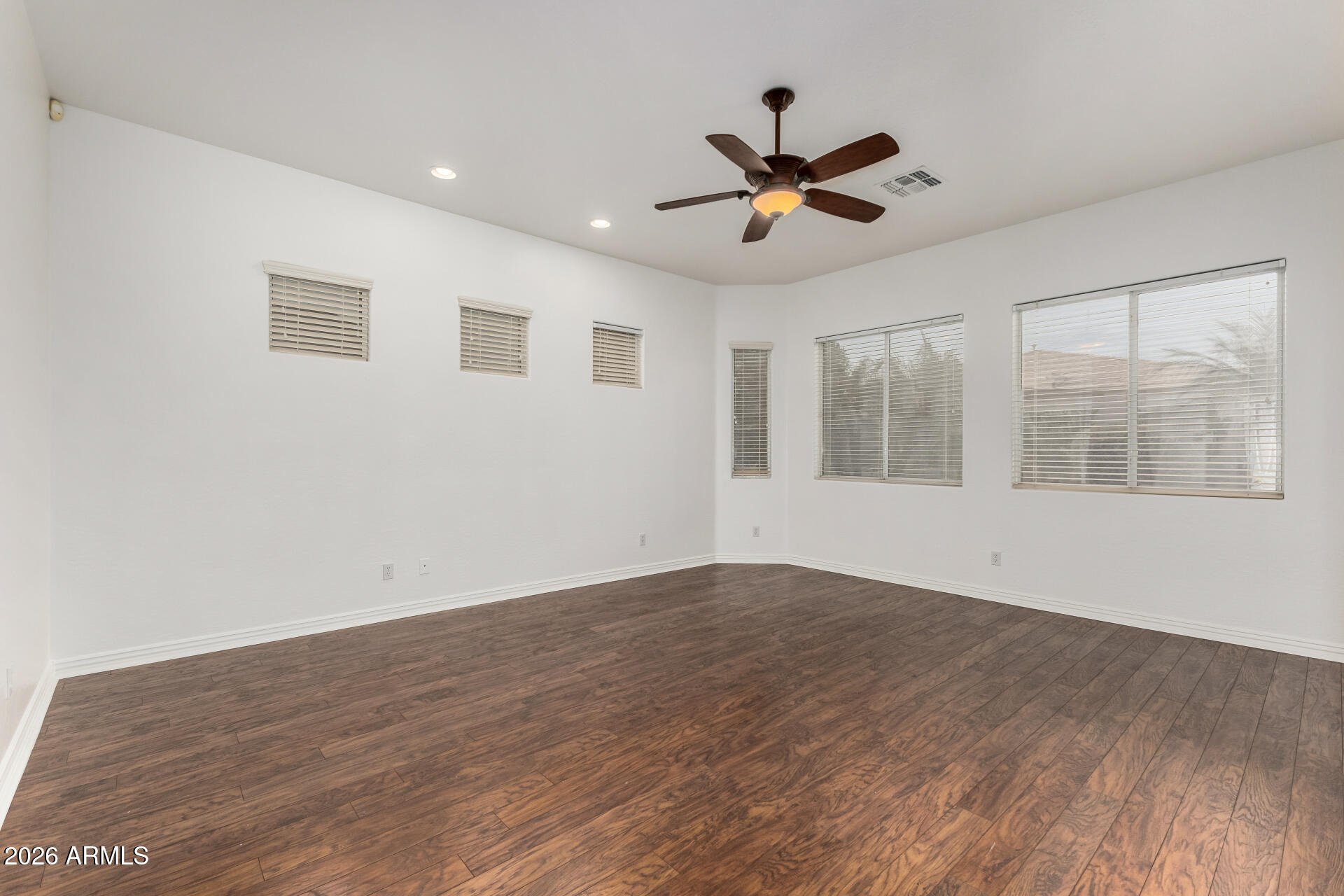 9638 West Bajada Road Peoria, AZ 85383 - Photo 11 of 26 a view of empty room with wooden floor and fan