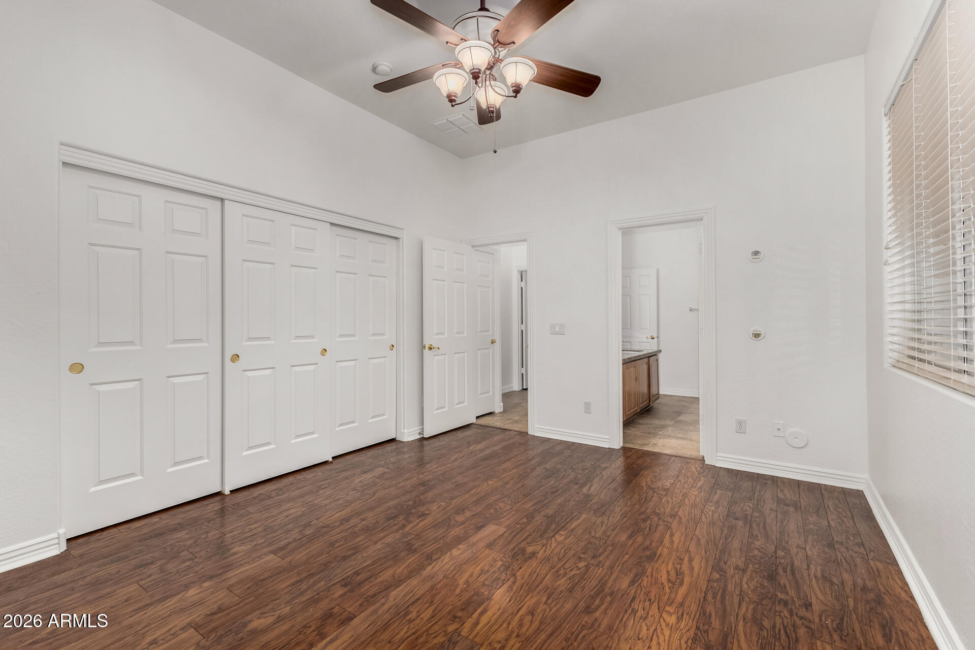9638 West Bajada Road Peoria, AZ 85383 - Photo 18 of 26 a view of an empty room with wooden floor