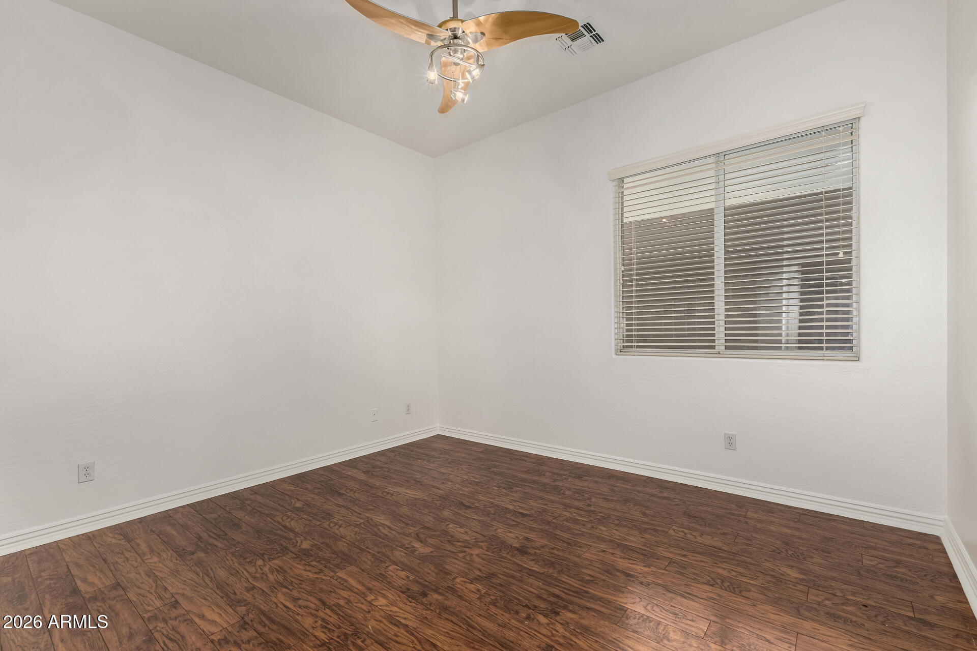 9638 West Bajada Road Peoria, AZ 85383 - Photo 19 of 26 wooden floor in an empty room with a window