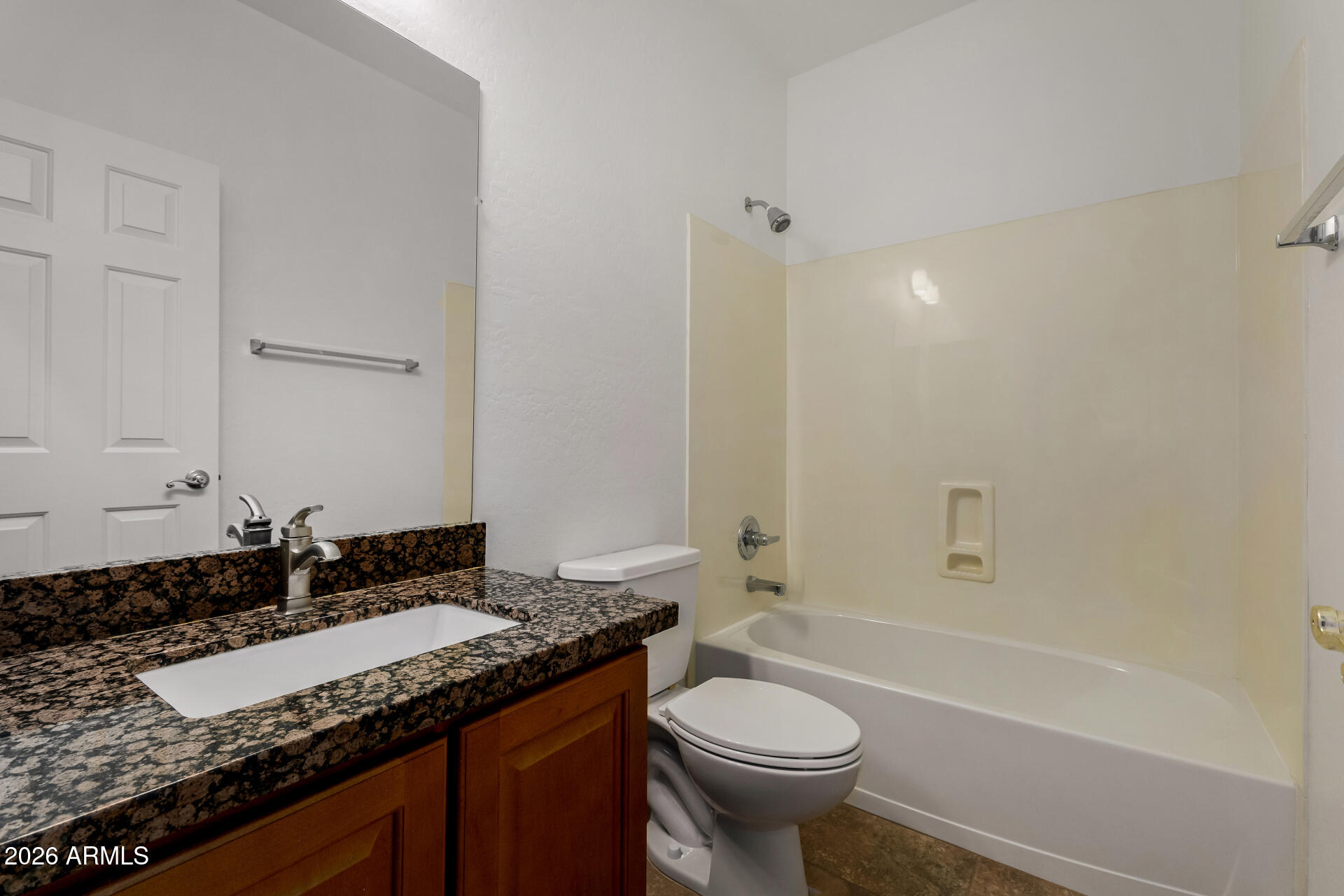 9638 West Bajada Road Peoria, AZ 85383 - Photo 20 of 26 a bathroom with a granite countertop sink and a mirror