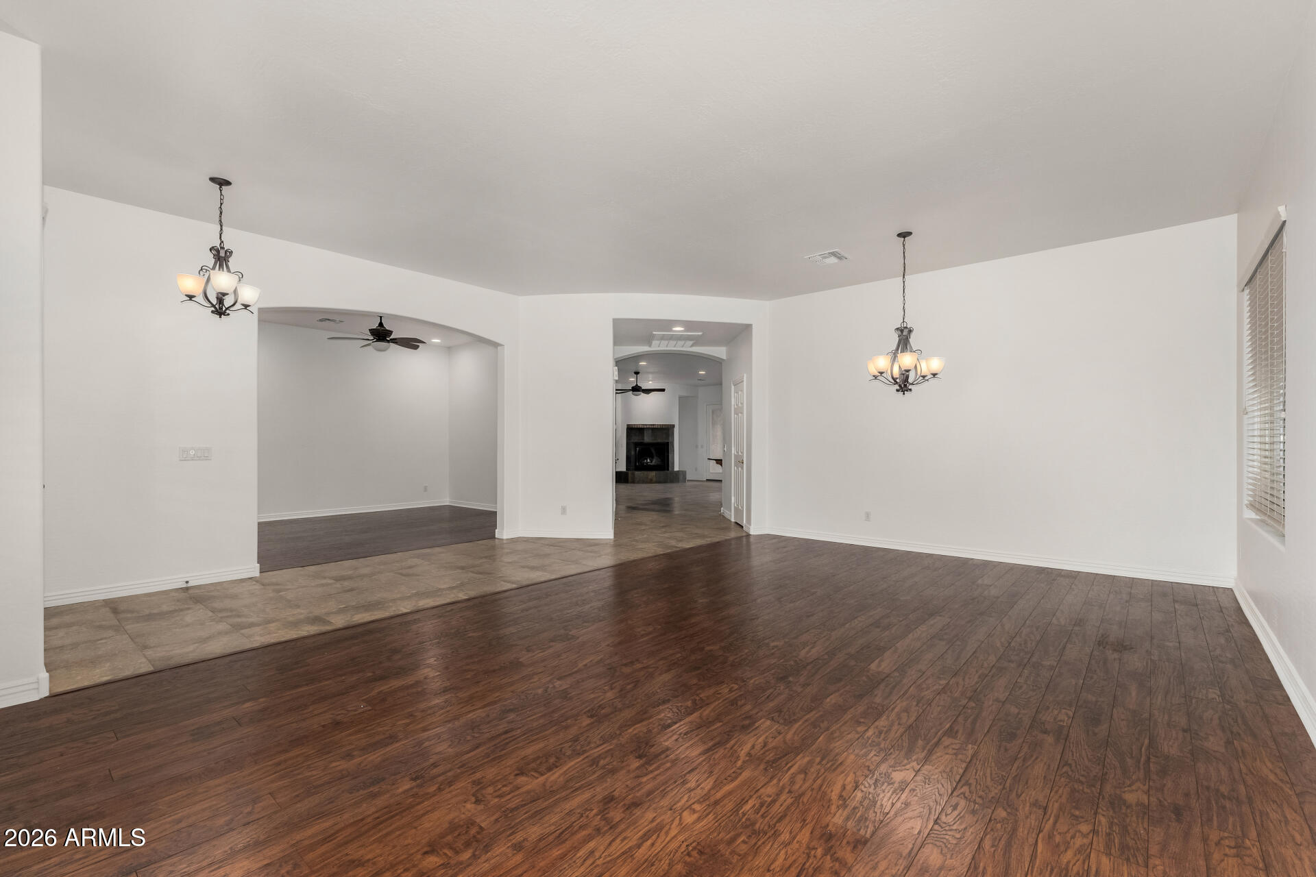 9638 West Bajada Road Peoria, AZ 85383 - Photo 3 of 26 an empty room with wooden floor and entrance