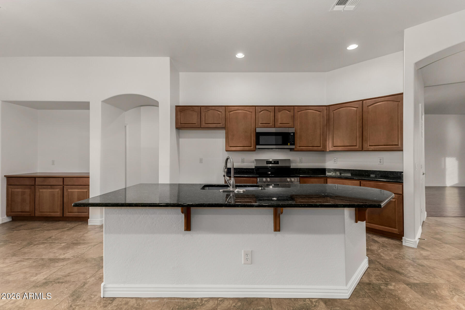 9638 West Bajada Road Peoria, AZ 85383 - Photo 5 of 26 a kitchen with a sink a stove and cabinets