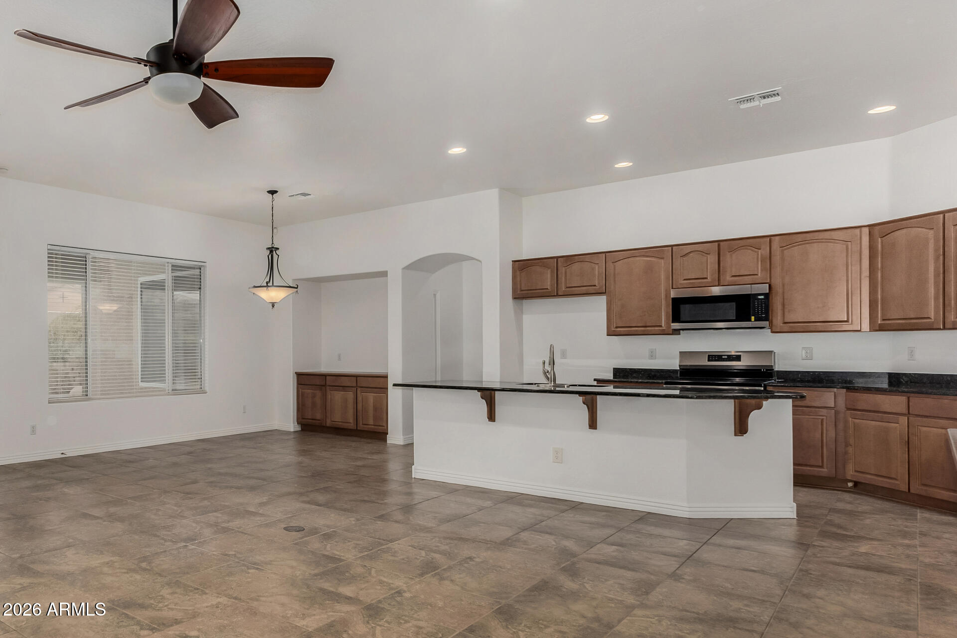 9638 West Bajada Road Peoria, AZ 85383 - Photo 8 of 26 a kitchen with stainless steel appliances granite countertop a stove and a sink