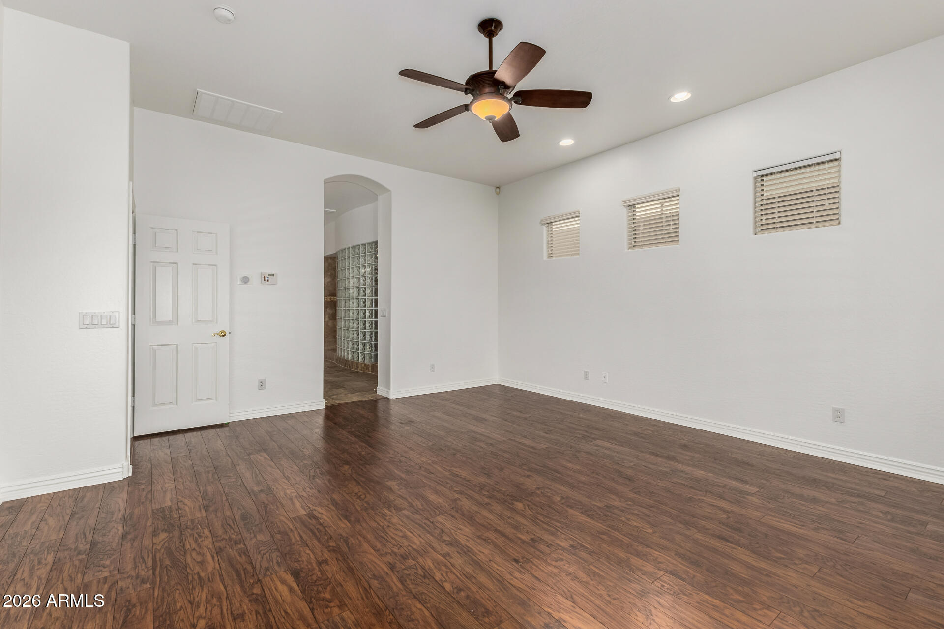 9638 West Bajada Road Peoria, AZ 85383 - Photo 9 of 26 a view of an empty room with wooden floor