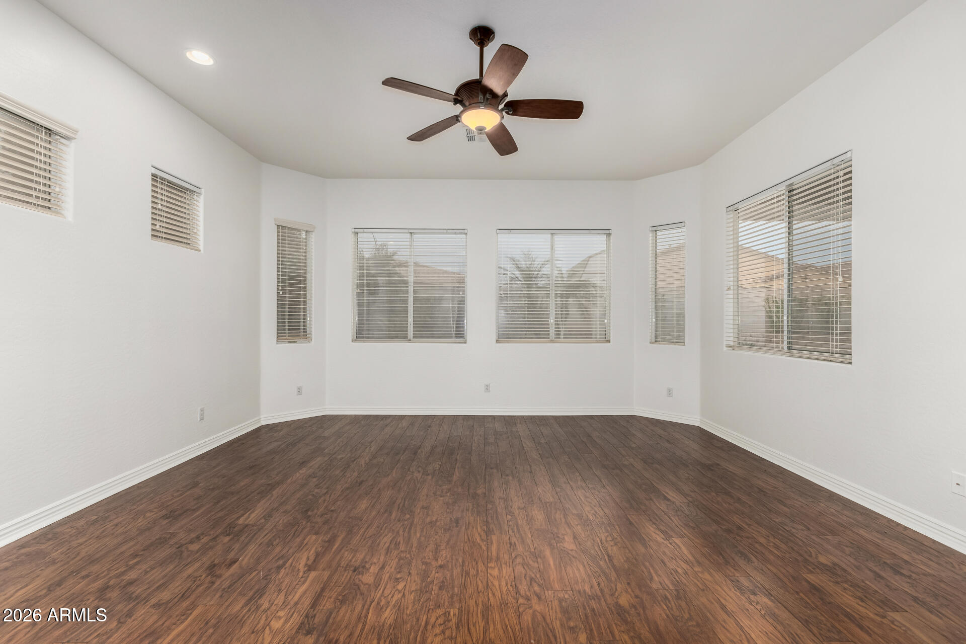 9638 West Bajada Road Peoria, AZ 85383 - Photo 10 of 26 a view of empty room with wooden floor and fan