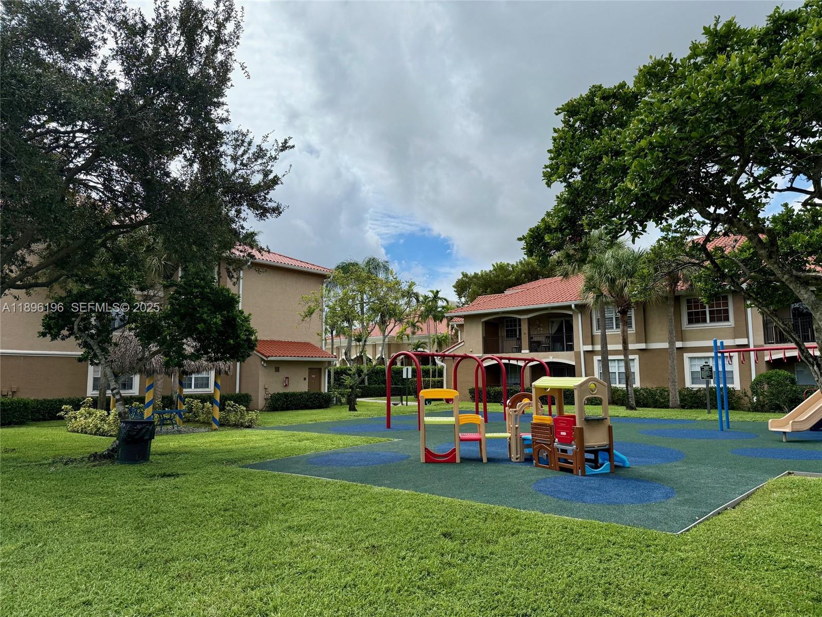 11601 Southwest 2nd Street, Unit 21301 Pembroke Pines, FL 33025 - Photo 11 of 21 a view of a house with a back yard