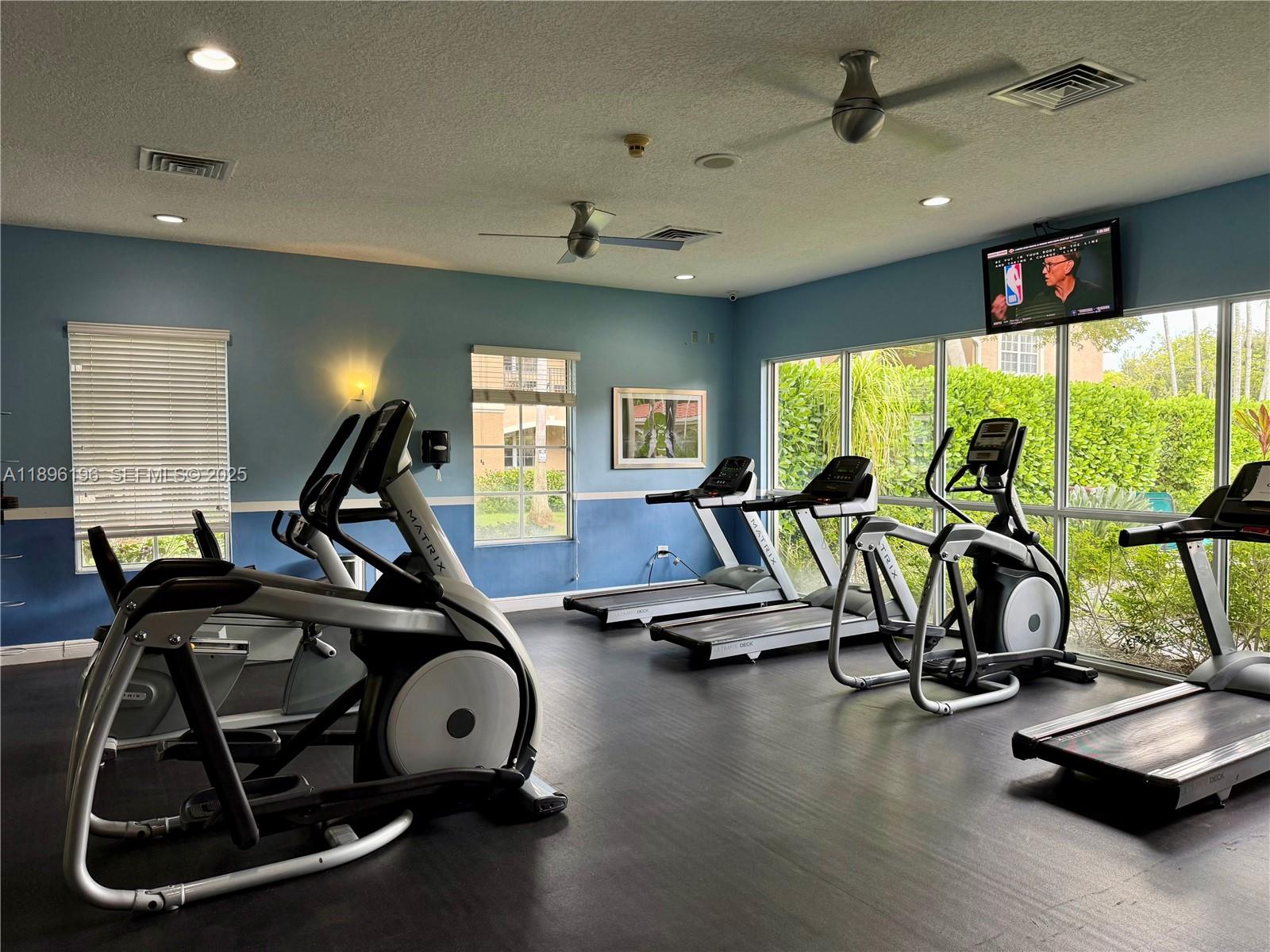 11601 Southwest 2nd Street, Unit 21301 Pembroke Pines, FL 33025 - Photo 16 of 21 a view of a room with gym equipment