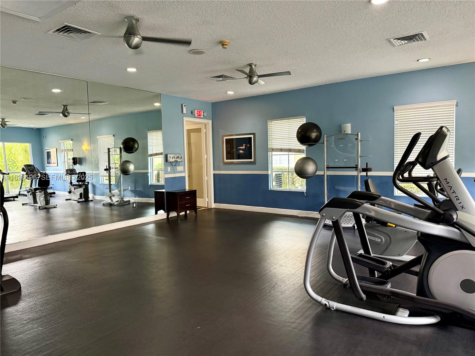 11601 Southwest 2nd Street, Unit 21301 Pembroke Pines, FL 33025 - Photo 17 of 21 a view of a room with gym equipment