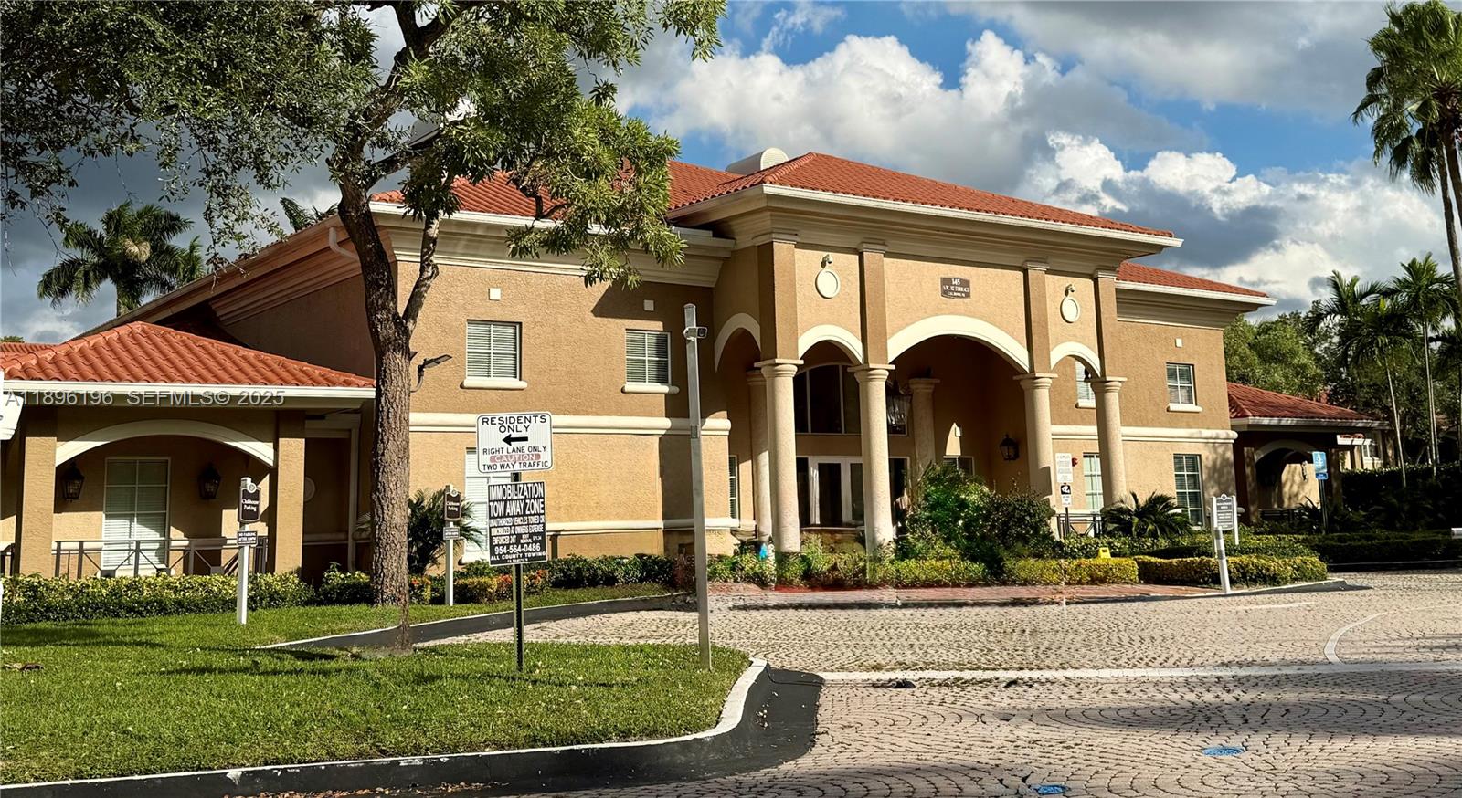 11601 Southwest 2nd Street, Unit 21301 Pembroke Pines, FL 33025 - Photo 21 of 21 a front view of a house with a garden