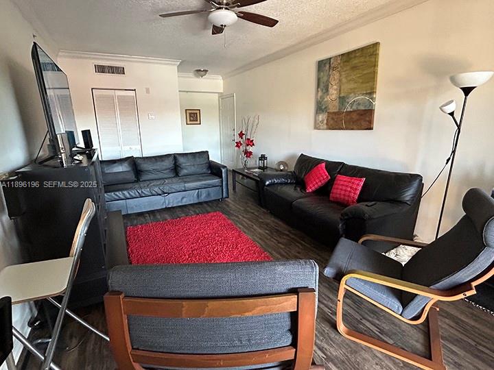 11601 Southwest 2nd Street, Unit 21301 Pembroke Pines, FL 33025 - Photo 4 of 21 a living room with furniture and a flat screen tv