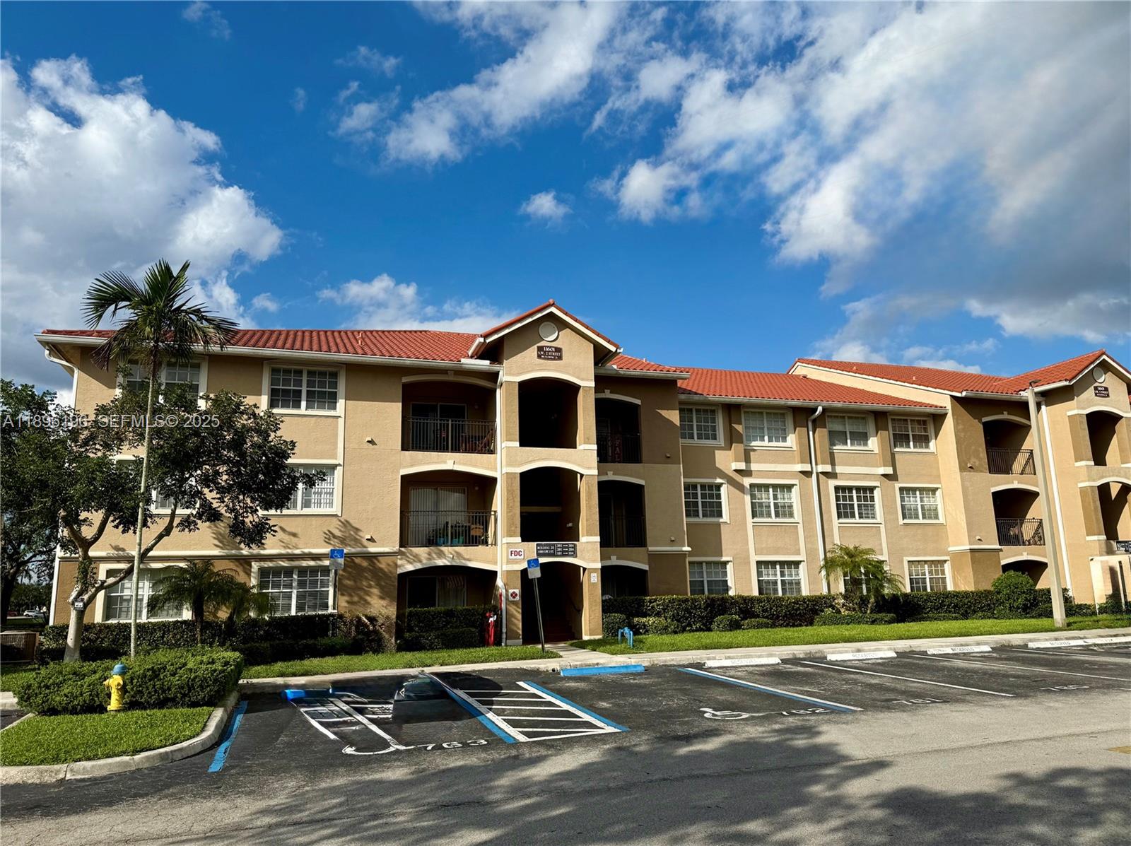 11601 Southwest 2nd Street, Unit 21301 Pembroke Pines, FL 33025 - Photo 10 of 21 a view of large building with a street