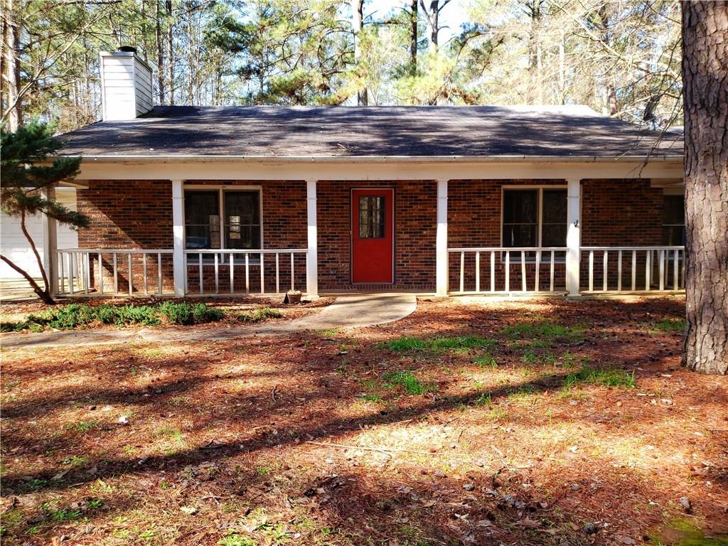 6675 White Mill Road Fairburn, GA 30213 - Photo 1 of 1 a front view of a house with a garden