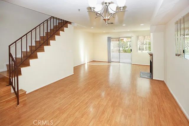 a view of an entryway with wooden floor