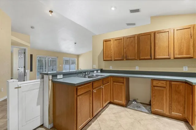 a kitchen with stainless steel appliances granite countertop a stove and a sink