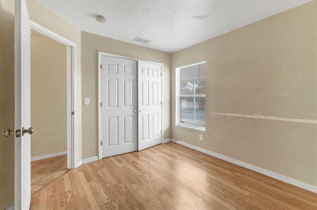 11619 Summit Rock Court Parrish, FL 34219 - Photo 20 of 36 wooden floor in an empty room
