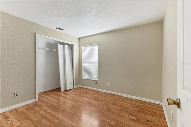 a view of room with wooden floor