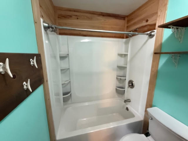 541 South Brocksmith Road Fort Pierce, FL 34945 - Photo 16 of 36 a bathroom with a bathtub and a shower