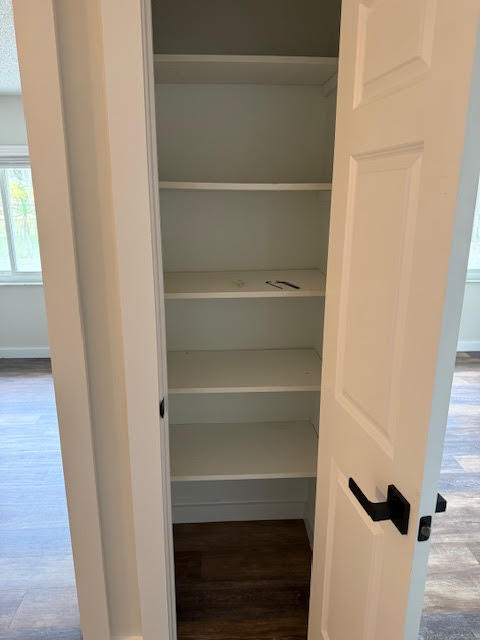 541 South Brocksmith Road Fort Pierce, FL 34945 - Photo 21 of 36 a view of walk in closet with empty racks