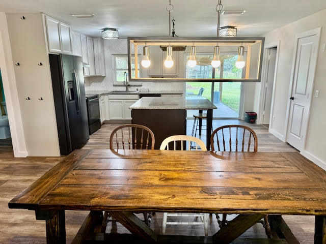 541 South Brocksmith Road Fort Pierce, FL 34945 - Photo 3 of 36 a view of kitchen and dining area with furniture