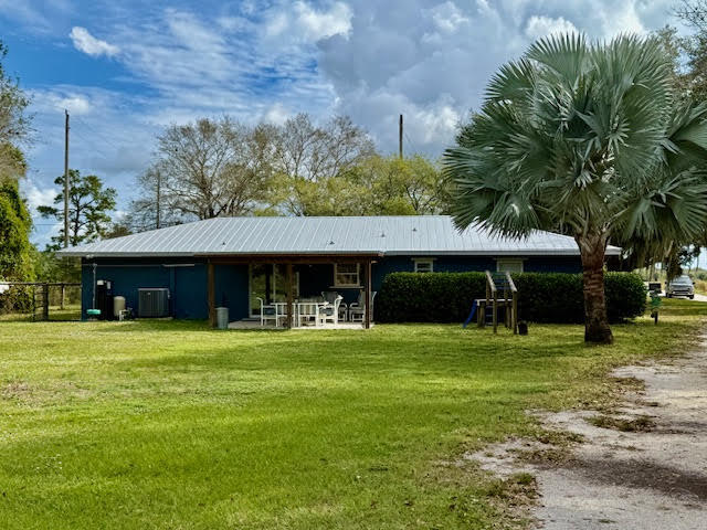 541 South Brocksmith Road Fort Pierce, FL 34945 - Photo 34 of 36 a front view of a house with a yard