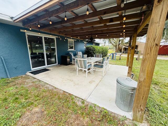 541 South Brocksmith Road Fort Pierce, FL 34945 - Photo 35 of 36 a view of a porch with furniture and front door
