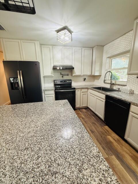 541 South Brocksmith Road Fort Pierce, FL 34945 - Photo 8 of 36 a kitchen with stainless steel appliances granite countertop a refrigerator a stove a sink dishwasher and a refrigerator