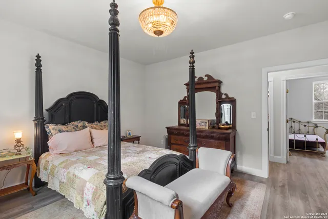 a bedroom with a bed and a dresser