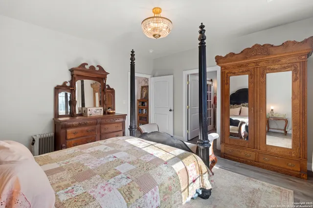a bathroom with a double vanity sink toilet mirror and bathtub