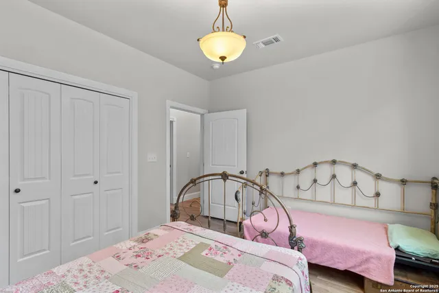 a view of storage and utility room with wooden floor