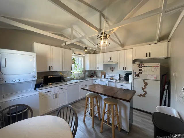a view of a house with a yard and garage