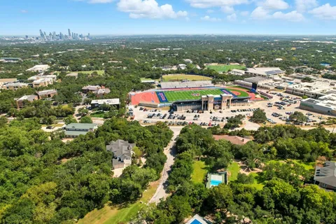 an aerial view of residential houses with outdoor space