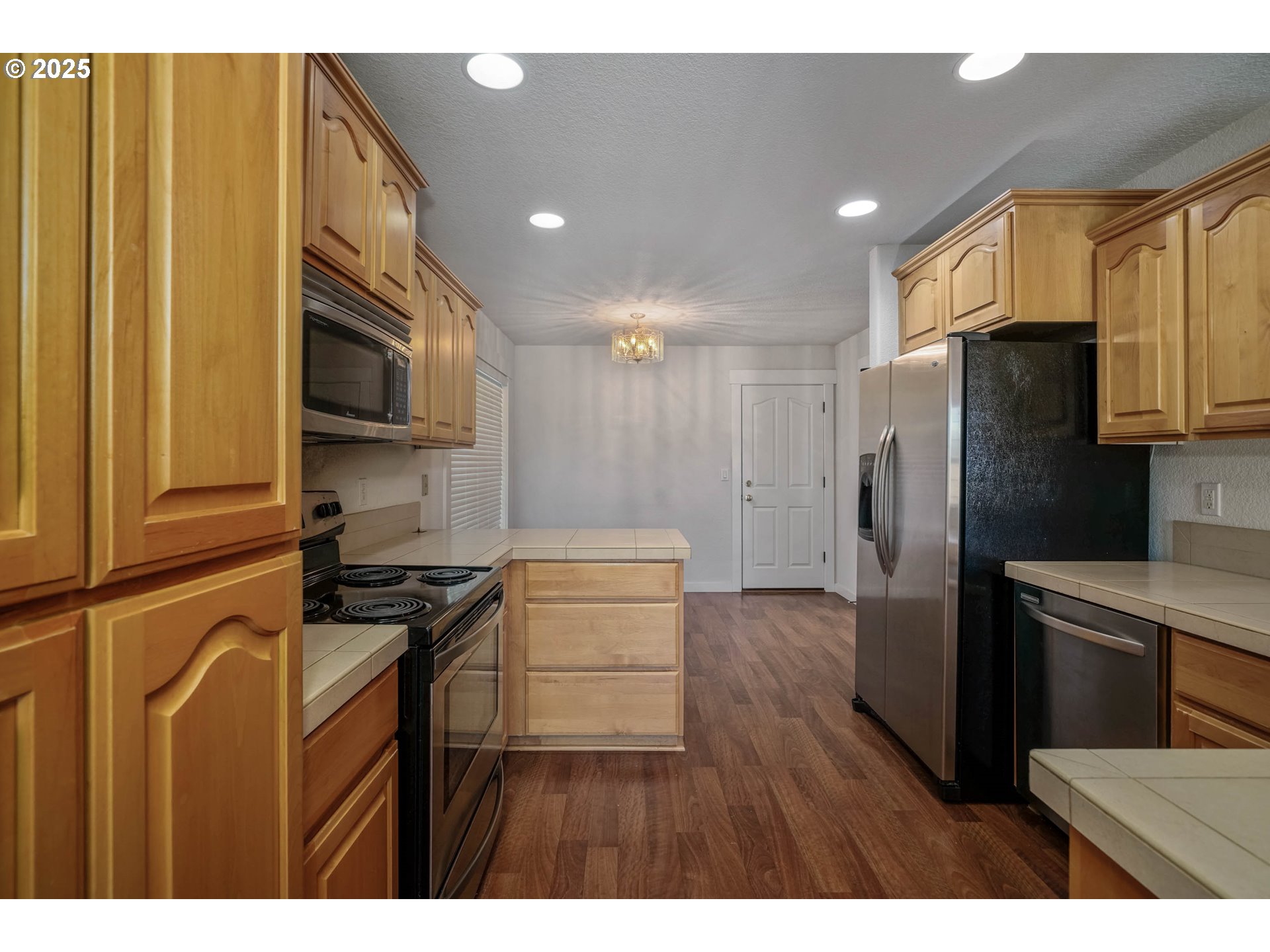 1897 Northeast Lucy Belle Street McMinnville, OR 97128 - Photo 15 of 39 a kitchen with kitchen island a counter space a sink appliances and cabinets