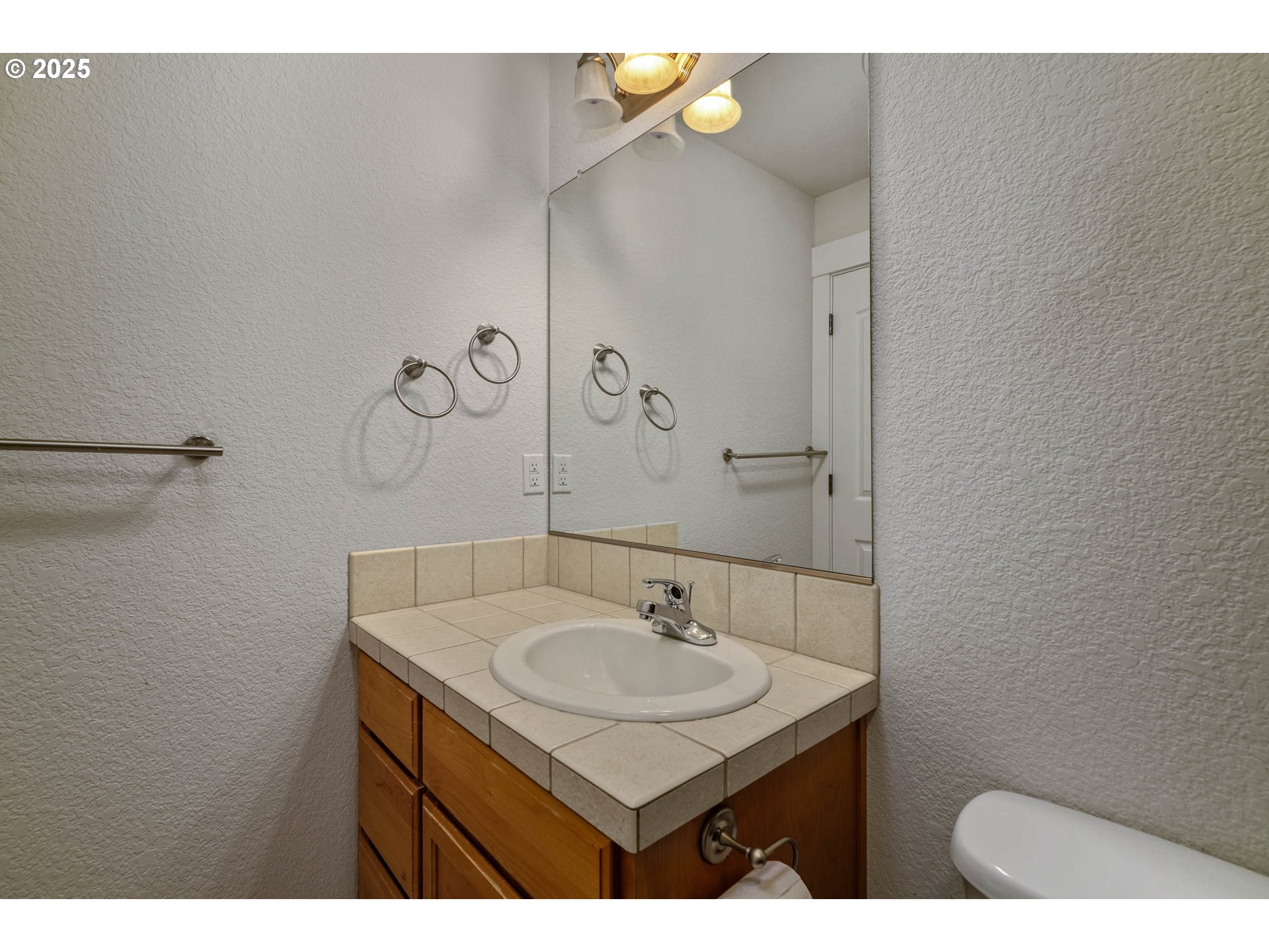 1897 Northeast Lucy Belle Street McMinnville, OR 97128 - Photo 22 of 39 a bathroom with a sink and a mirror