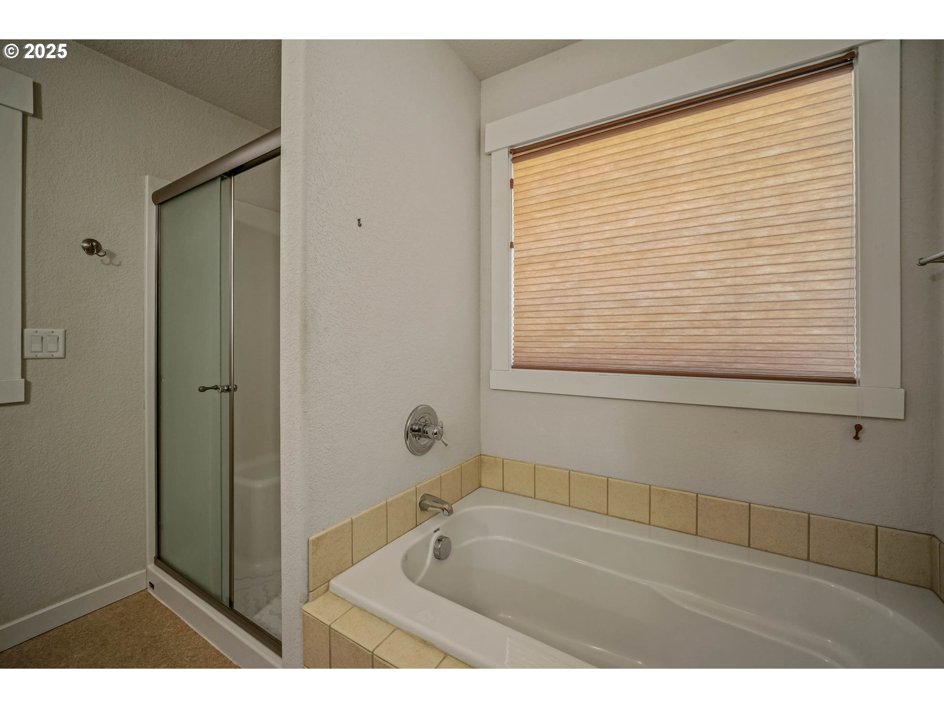 1897 Northeast Lucy Belle Street McMinnville, OR 97128 - Photo 24 of 39 a bathroom with a bathtub and a shower