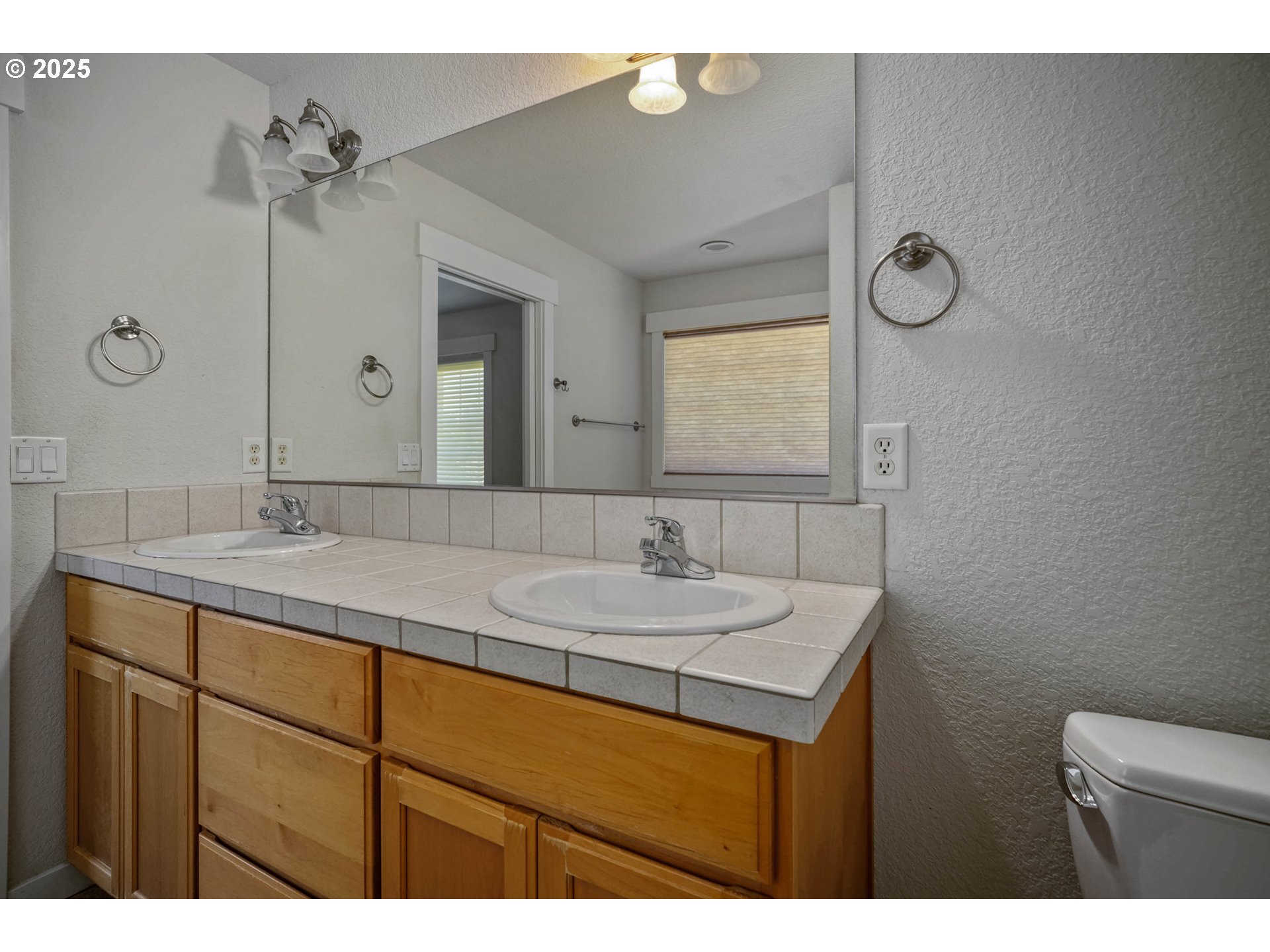 1897 Northeast Lucy Belle Street McMinnville, OR 97128 - Photo 26 of 39 a bathroom with a sink vanity granite and a mirror