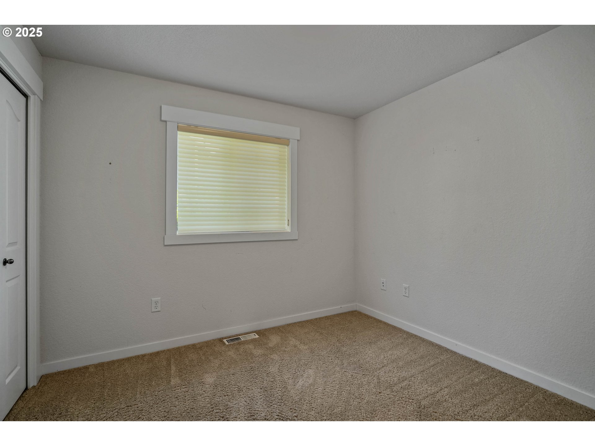 1897 Northeast Lucy Belle Street McMinnville, OR 97128 - Photo 30 of 39 a view of an empty room with a window