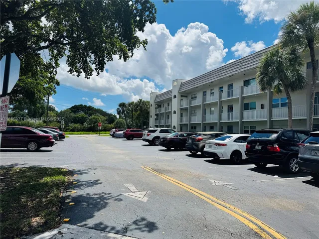 a view of street with parked cars