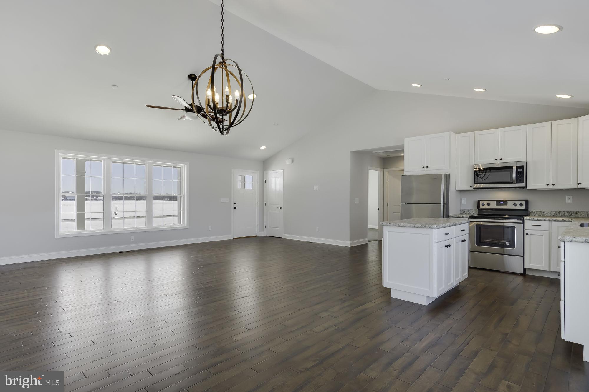 Open Flow With Gleaming Hardwood Floors
