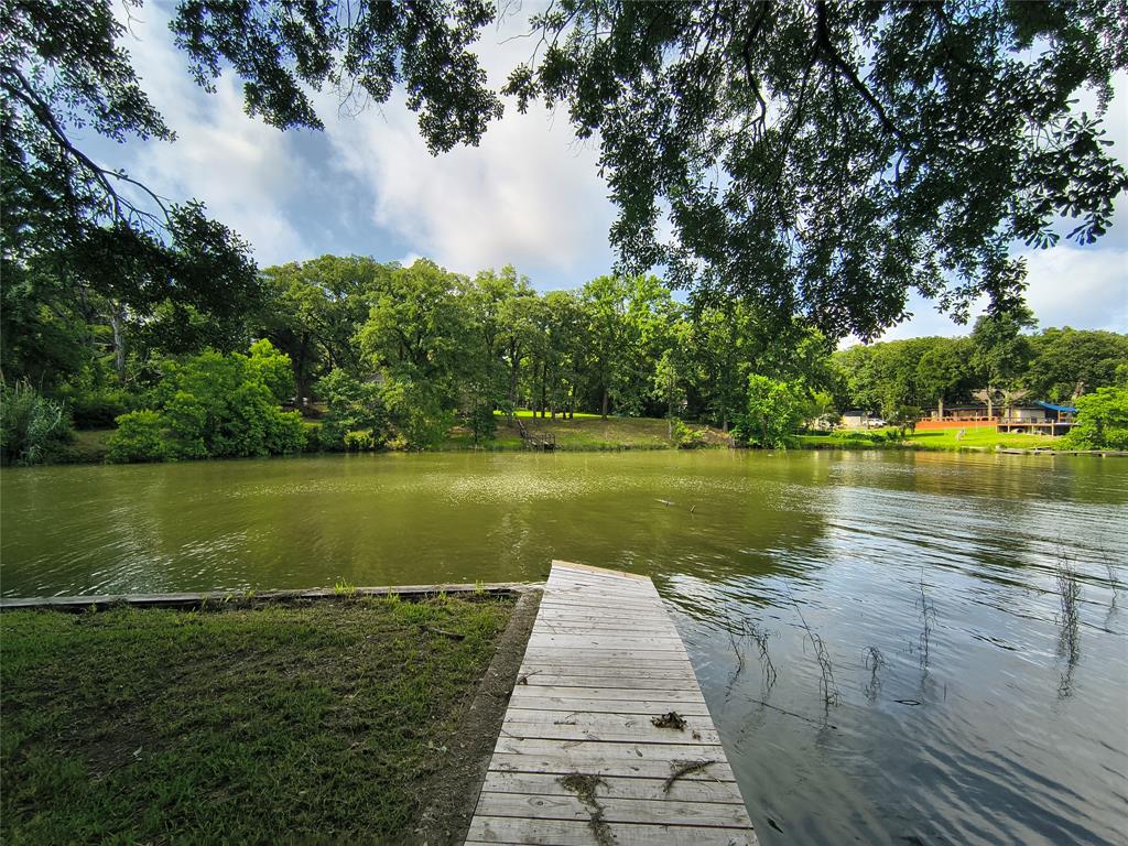 180 Arrowhead Street Mabank, TX 75156 - Photo 14 of 26 a view of a lake with a large trees