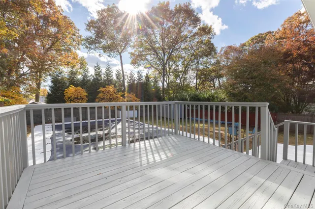 a swimming pool with outdoor seating and yard