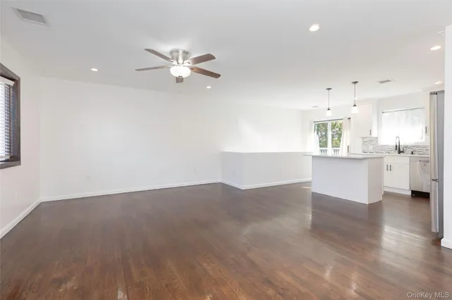 a kitchen with a stove a refrigerator and a sink