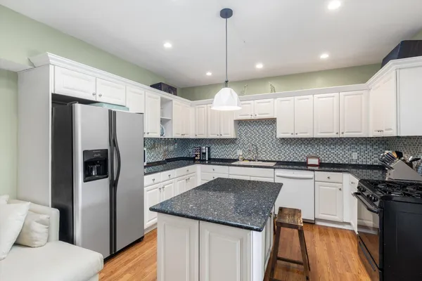 a bathroom with a sink toilet and a mirror