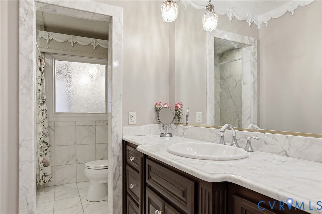 13300 West Patrick Henry Road Doswell, VA 23047 - Photo 21 of 69 Vanity with an oval undermount sink and polished c