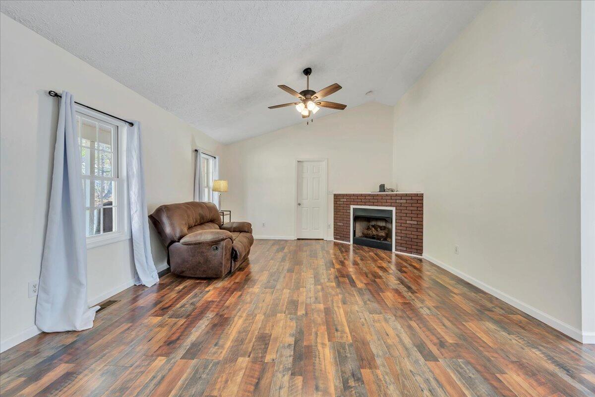 100 Old Post Road Moneta, VA 24121 - Photo 4 of 54 a living room with furniture and a fireplace