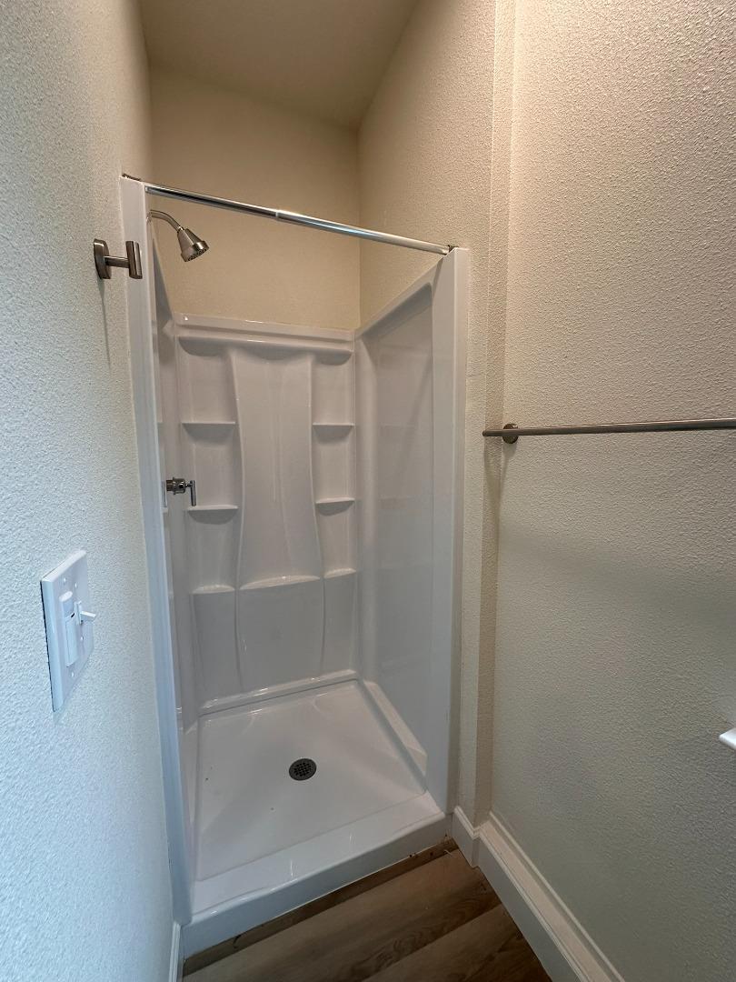 1220 Church Street Lodi, CA 95240 - Photo 29 of 31 a bathroom with a glass shower door