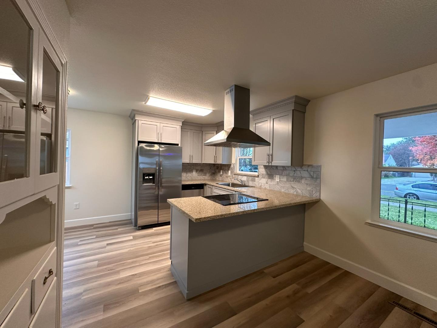 1220 Church Street Lodi, CA 95240 - Photo 5 of 31 a kitchen with stainless steel appliances granite countertop a sink stove and refrigerator