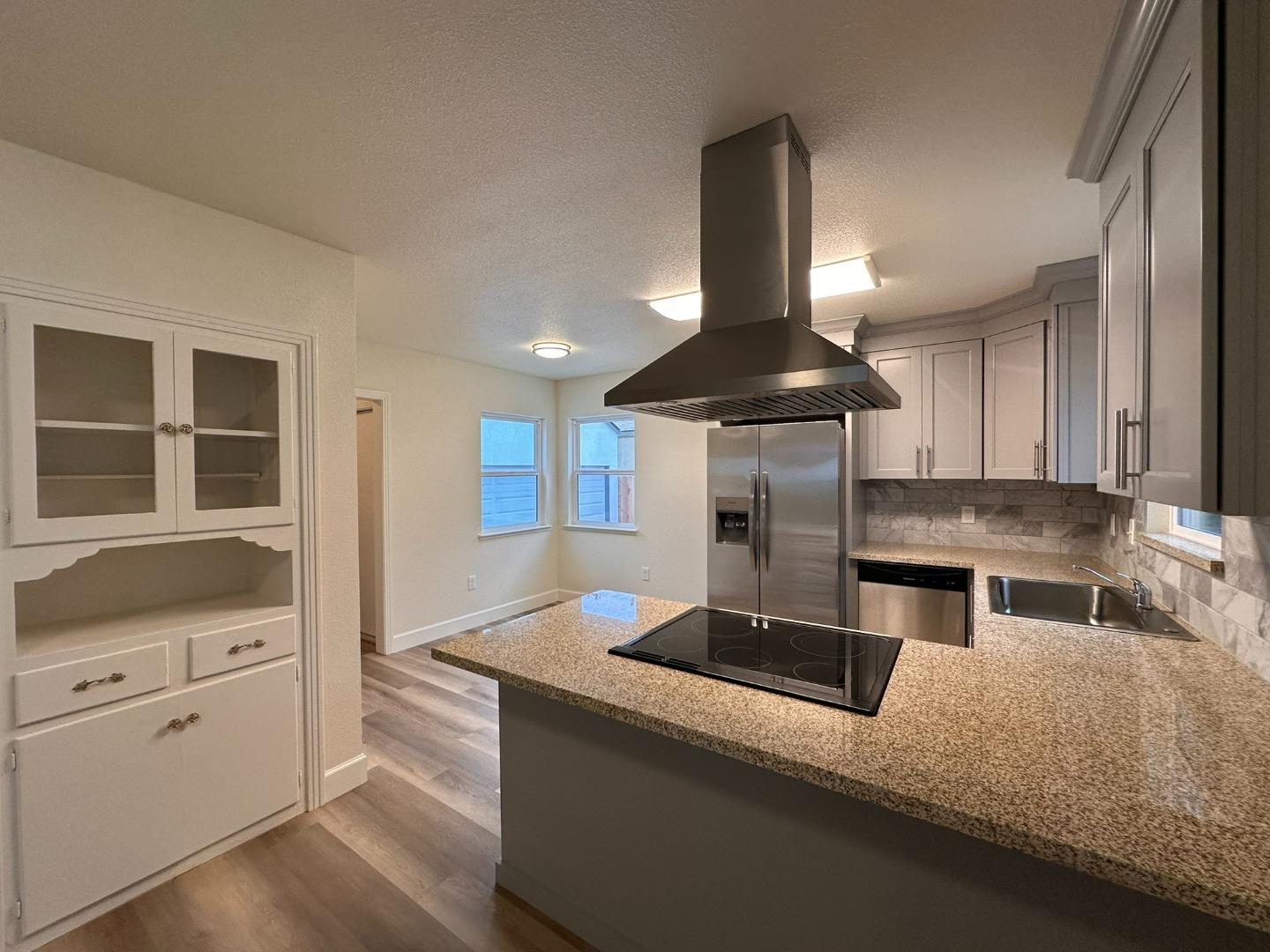 1220 Church Street Lodi, CA 95240 - Photo 6 of 31 a kitchen with stainless steel appliances granite countertop a sink stove and refrigerator