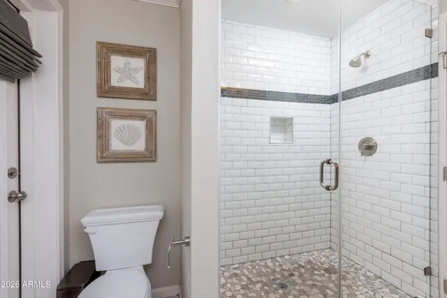 a bedroom with a bed and a book shelf