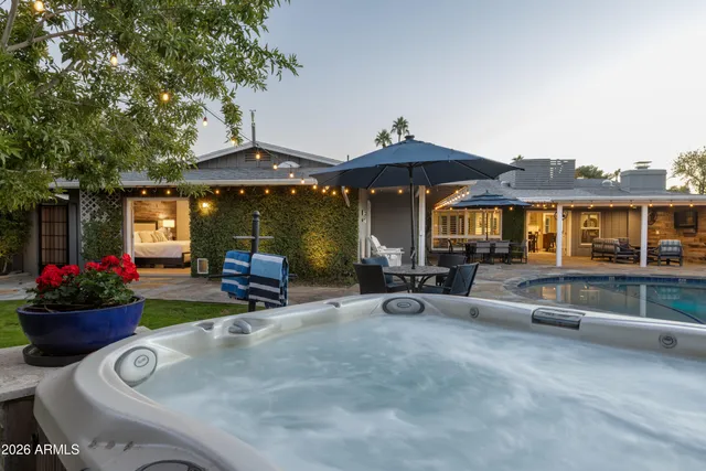 a view of a house with a porch and furniture